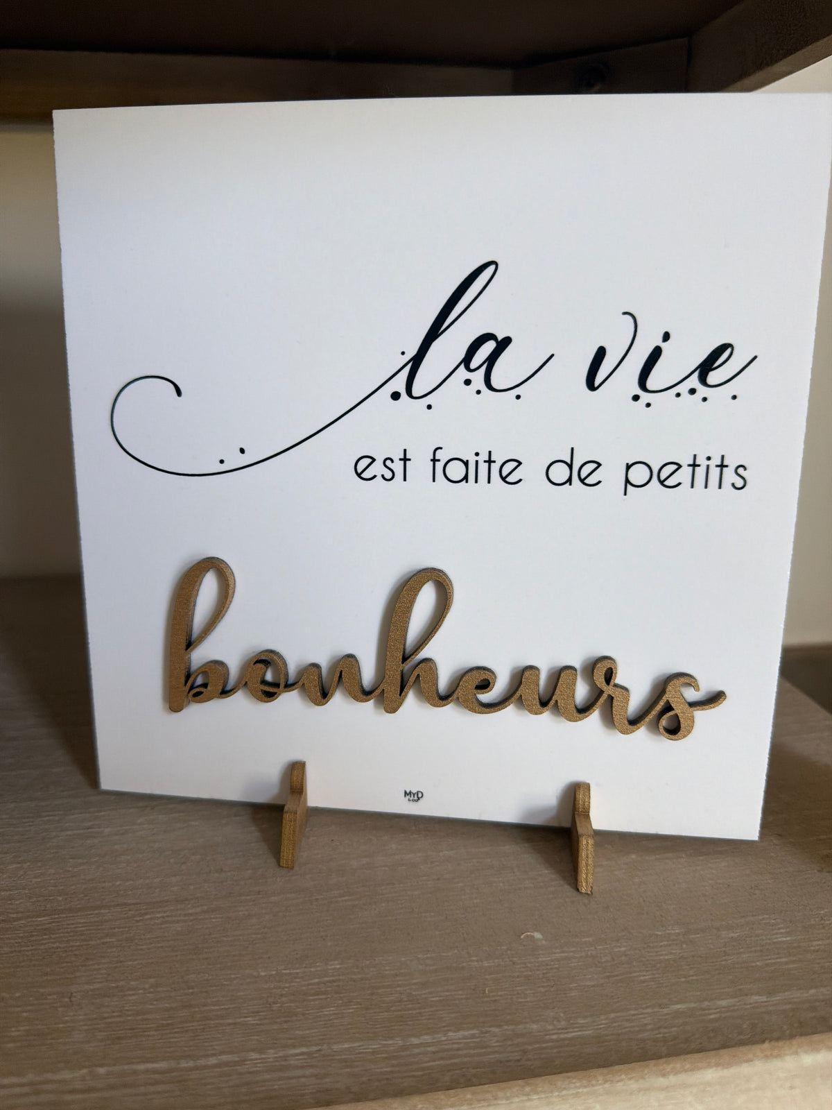 Cadre sur pieds dorés 