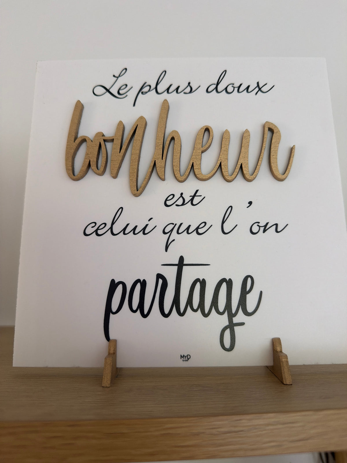 Cadre sur pieds dorés 