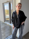 Chemise noire col diamant